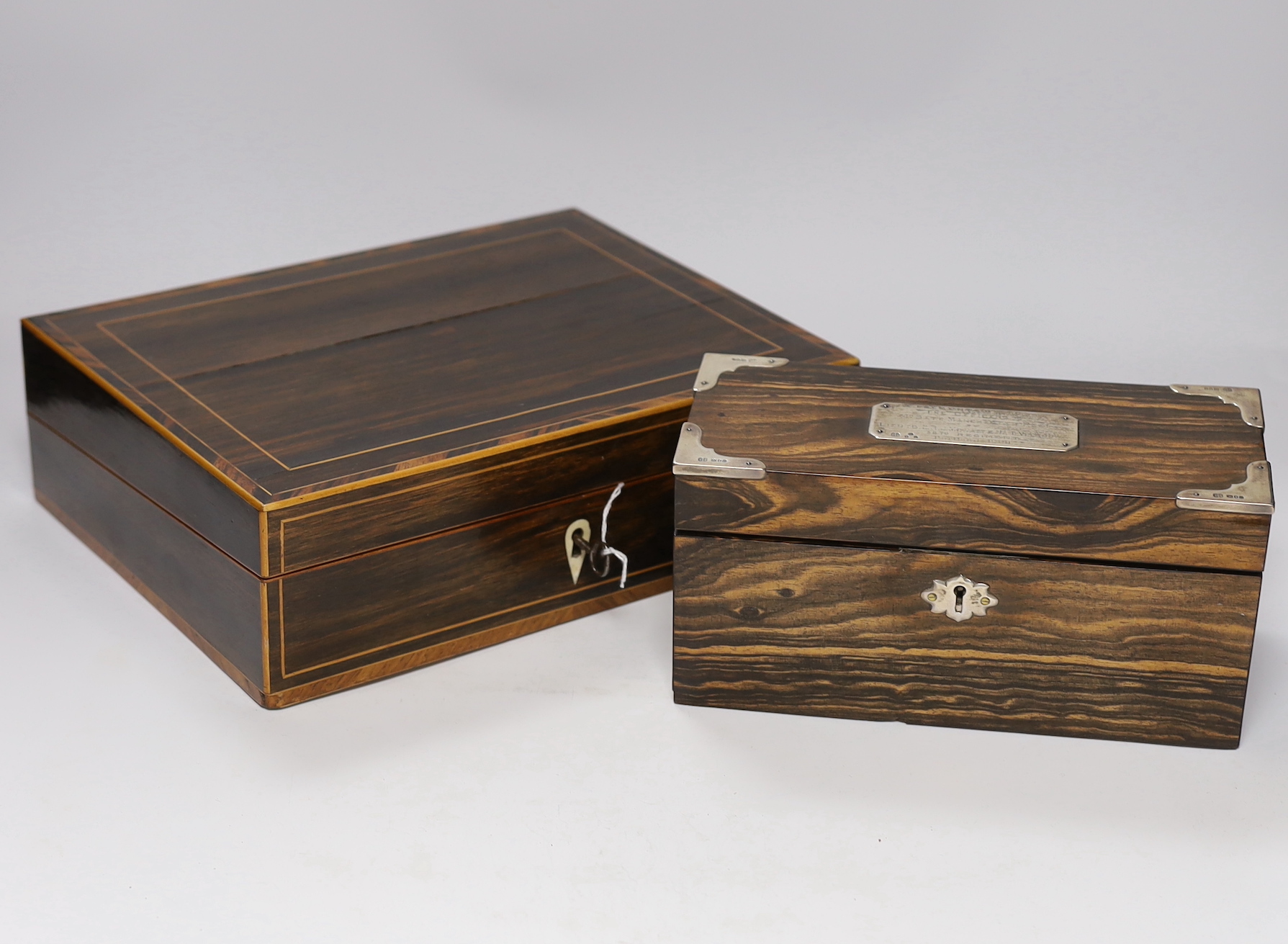 A 19th century coromandel writing slope with bone lock escutcheon and a Victorian silver mounted stationery box, largest 30cm wide